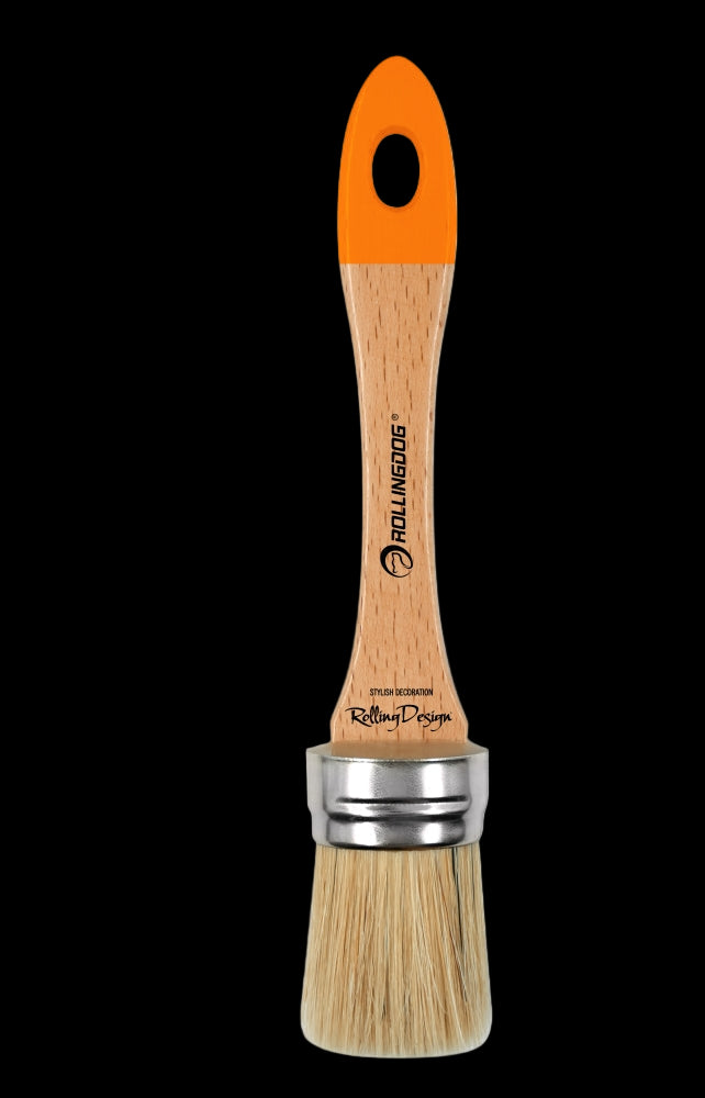 Angled view of oval chalk paint brush with wooden handle