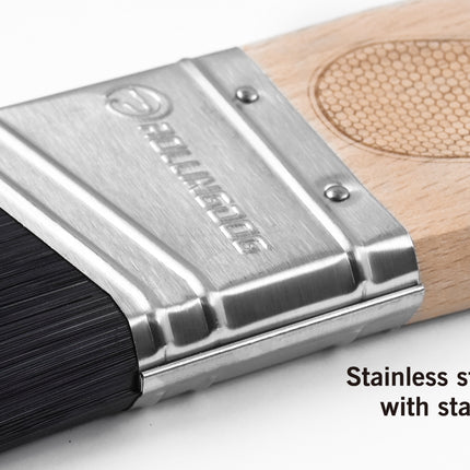 Paintbrush with stainless steel ferrule and wooden handle on a white background