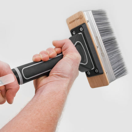 Deck brush attaching to extension pole