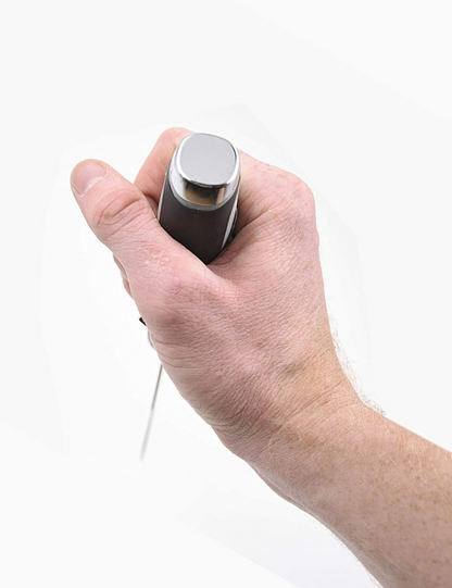 Hand holding a small electronic device on a white background