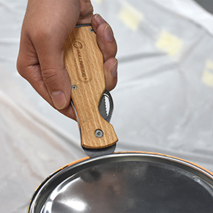 50217_Painter opening a can of paint