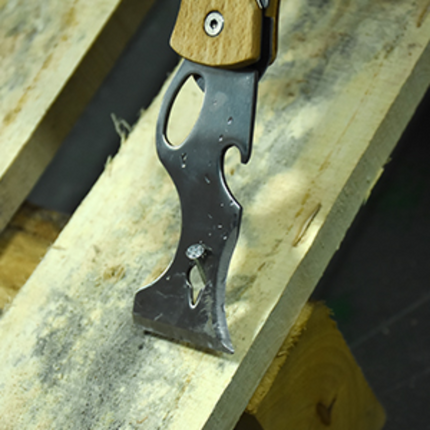 50217_Painter using multi-function tool for scraping paint