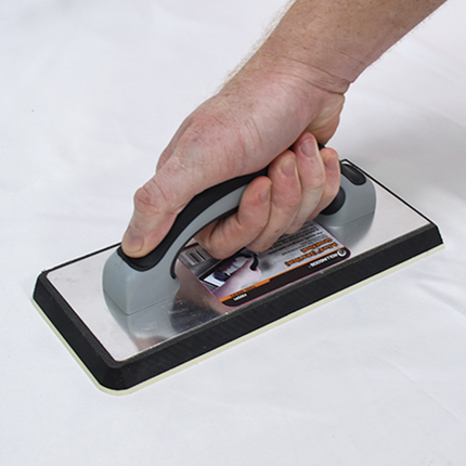 50291-Tiler applying grout with ergonomic foam-based grout float