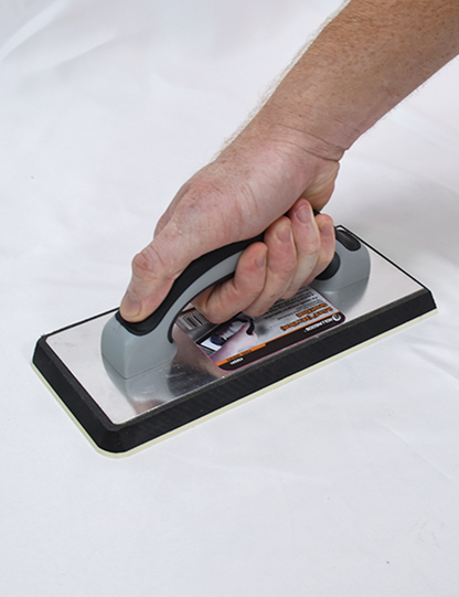 50291-Tiler applying grout with ergonomic foam-based grout float