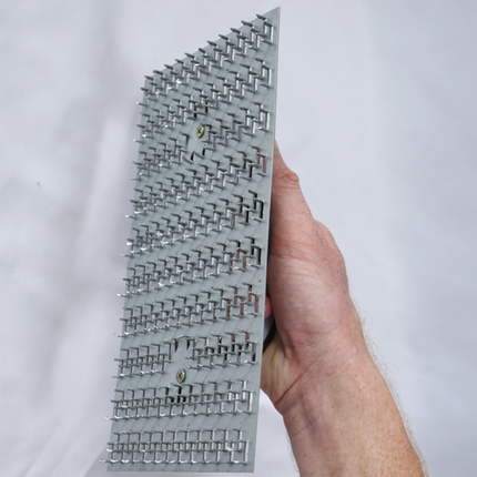 50295-another Worker using render scratching float to key plaster surface before finishing