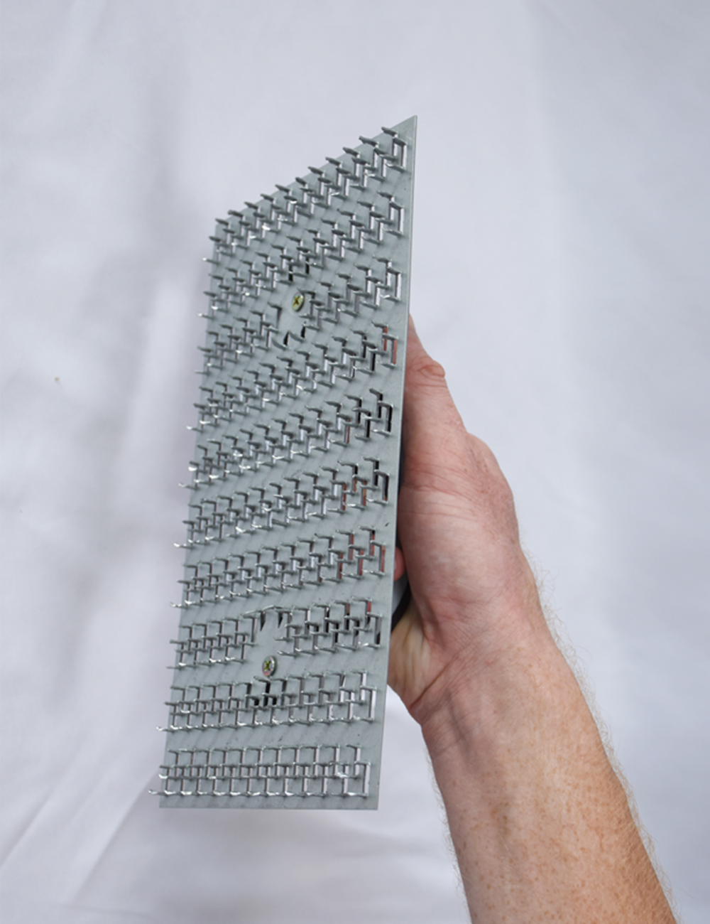 50295-another Worker using render scratching float to key plaster surface before finishing