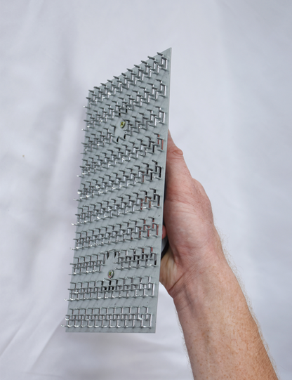 50295-another Worker using render scratching float to key plaster surface before finishing