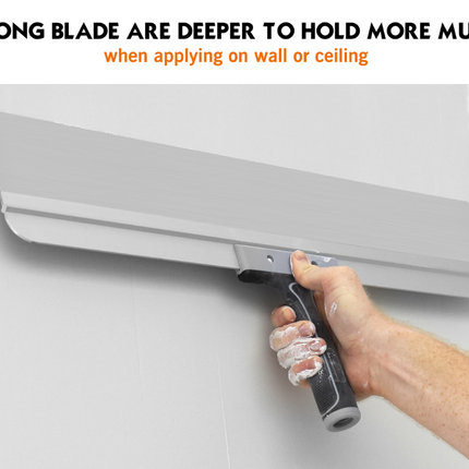 50504-Drywall finisher using 23-inch flexible taping knife to smooth compound on wide wall joint