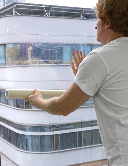 80006-Protective film applied to window surface during painting project
