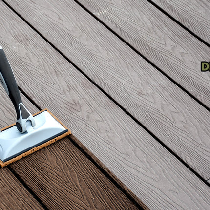 Pro-Angle deck-staining foam pad being used on a wooden deck with the brand logo visible.